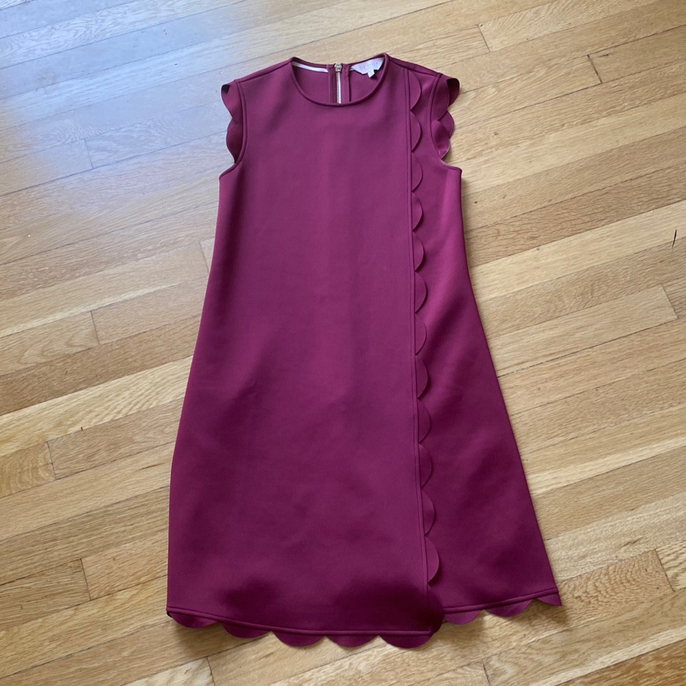 Ted Baker London, Maroon short sleeved dress with asymmetrical detailing.